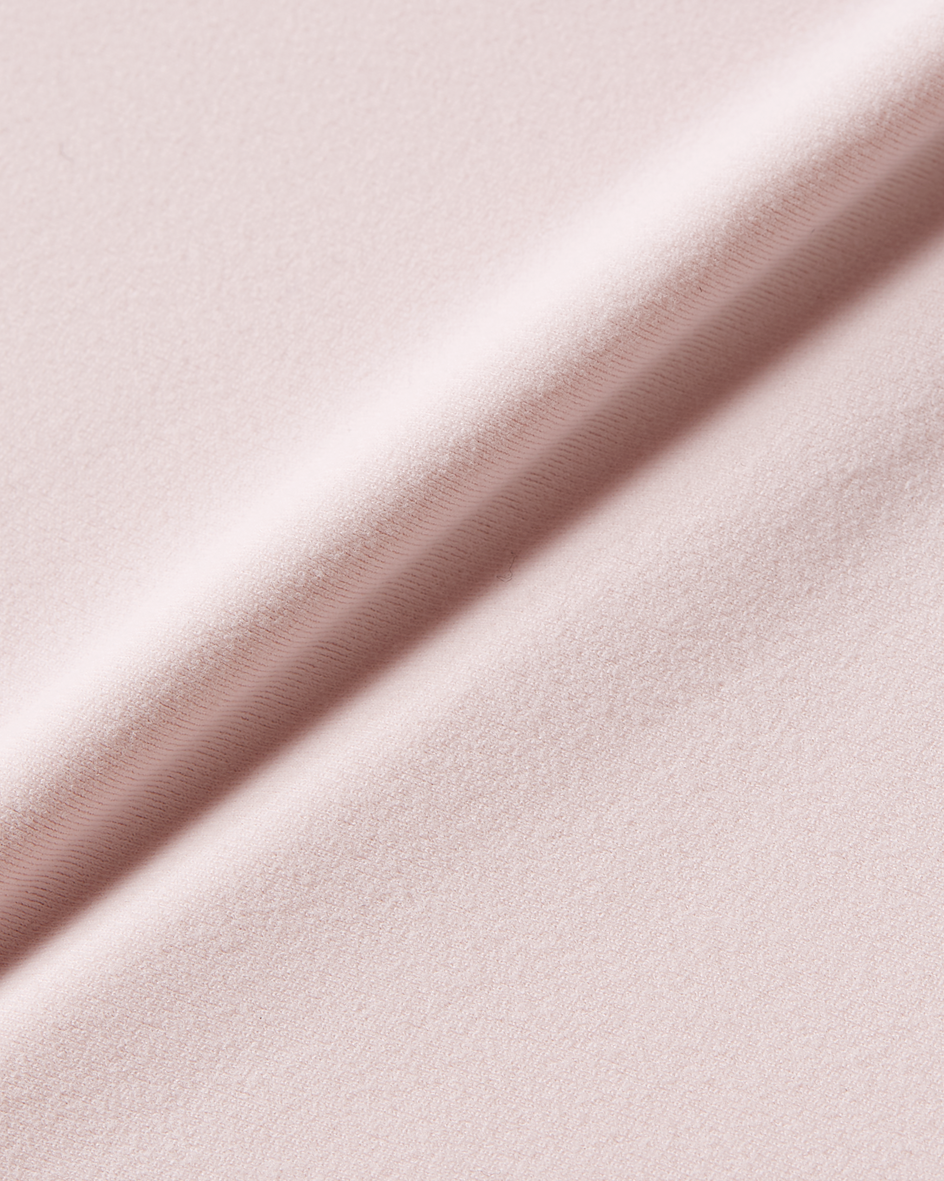 Pink fabric detail image showing breathable material with soft second skin comfort