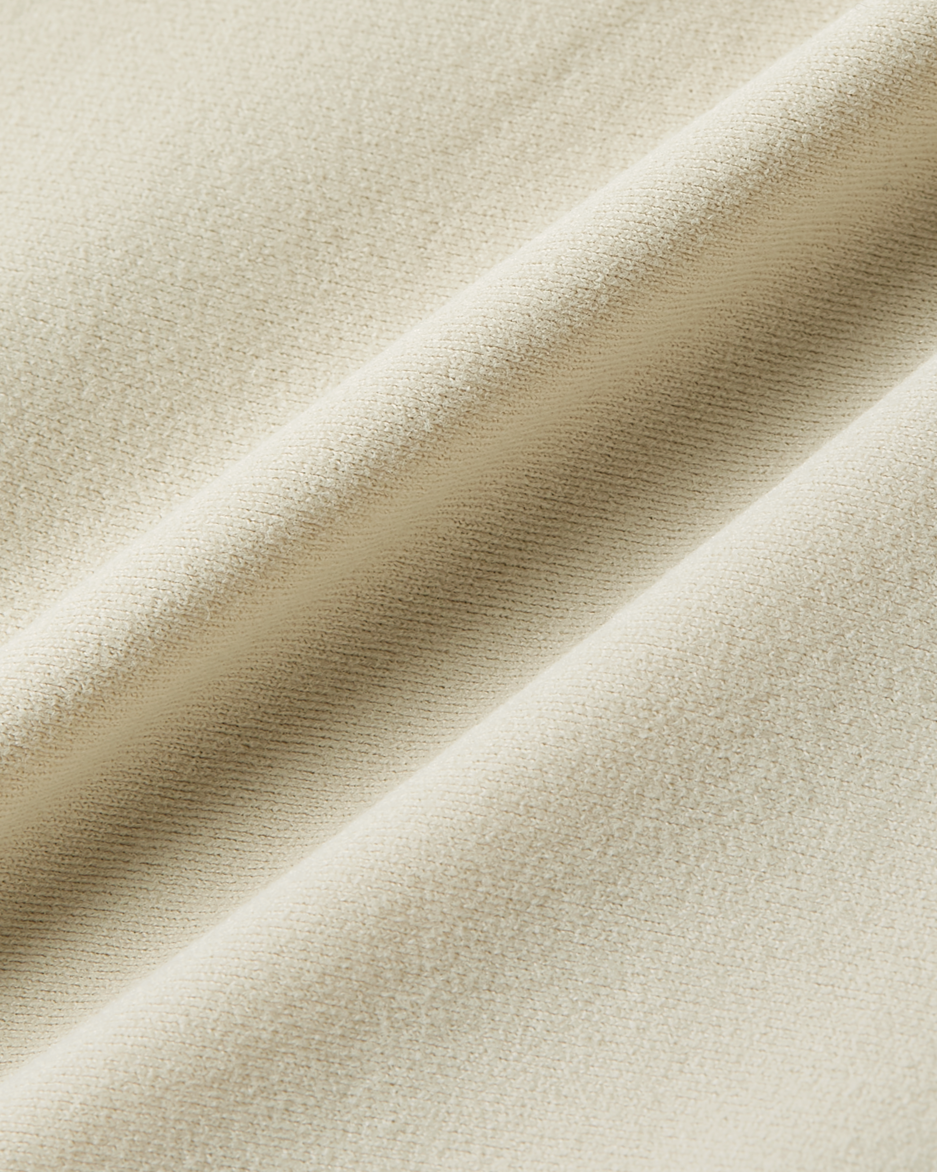 Close-up product photo of beige soft skin fabric with ultra stretch and smooth texture