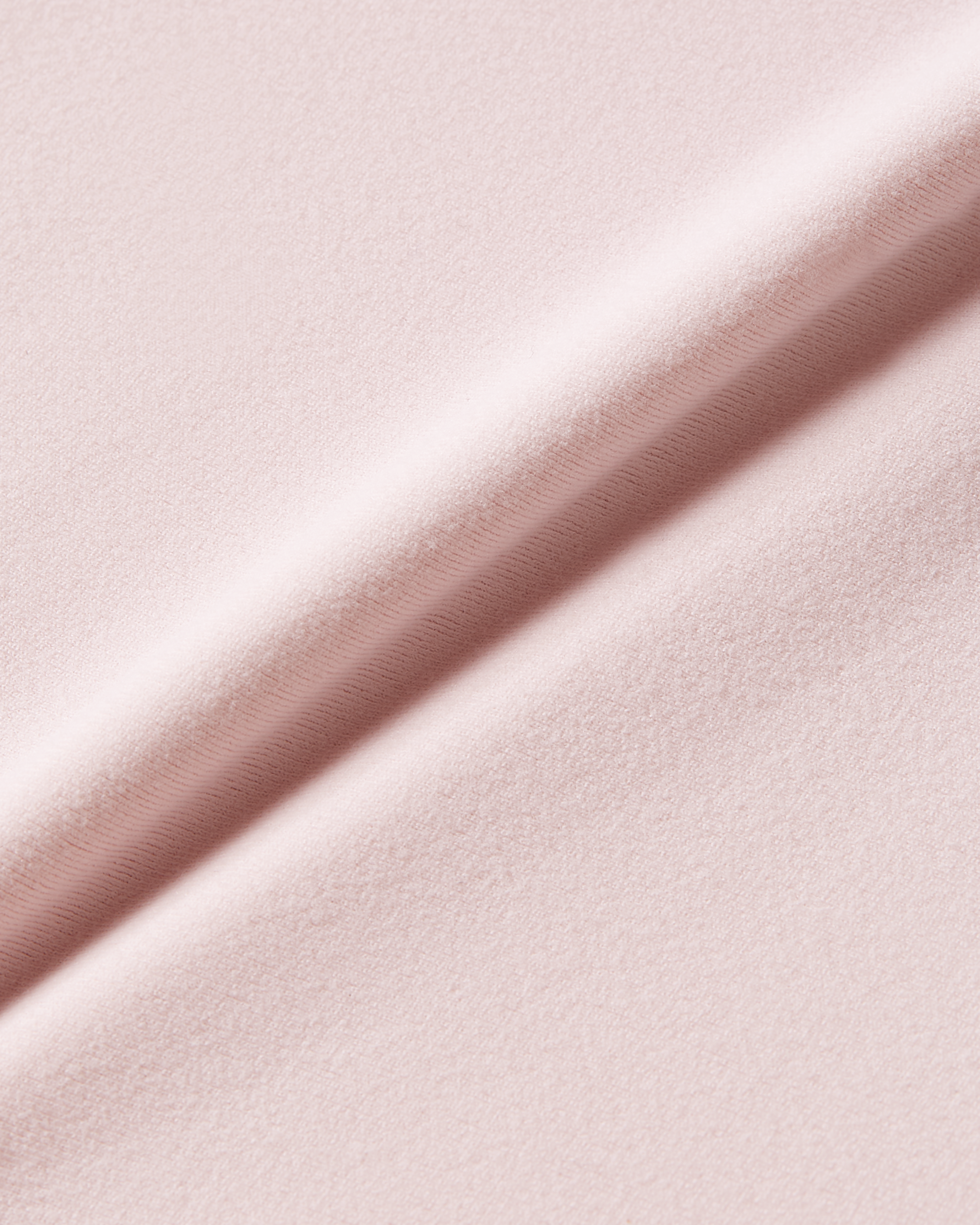 Pink fabric detail image showing lightweight elastic material with smooth texture