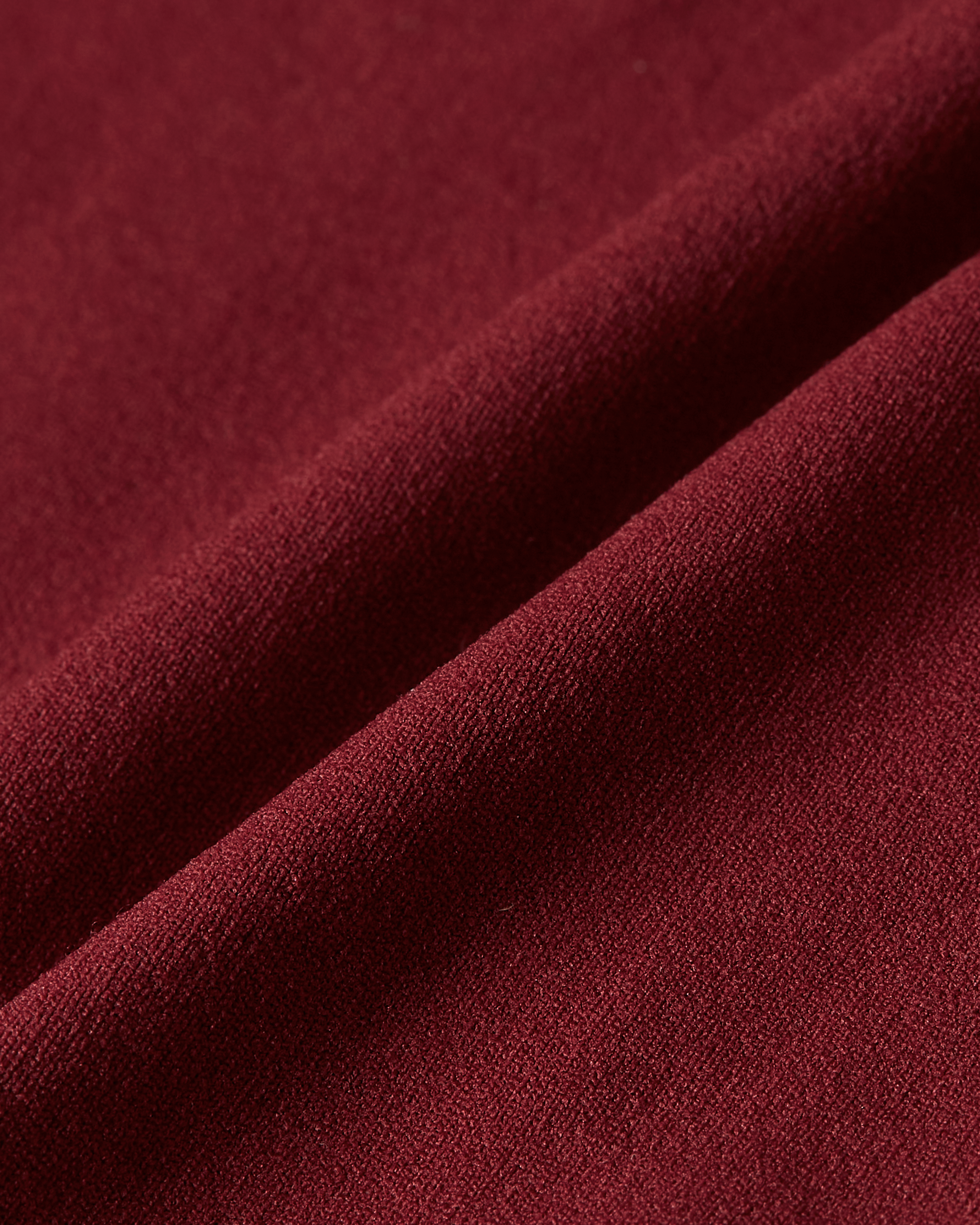 Close up detail of bordeaux shapewear bralette showing flexible compression fabric with a soft structure and supportive feel product image
