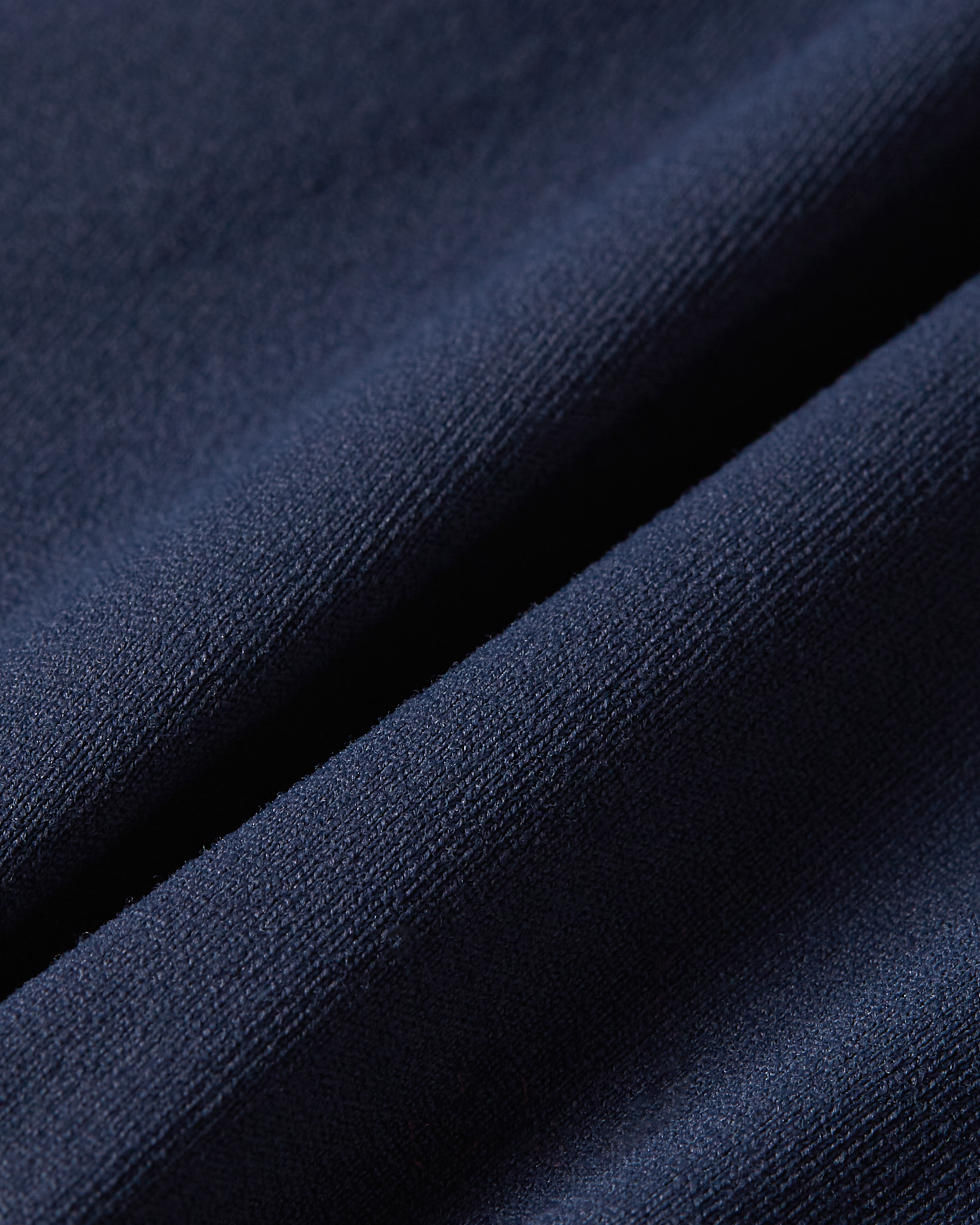 Detailed view of dark blue soft skin bralette fabric with a clean seamless look and a soft touch finish