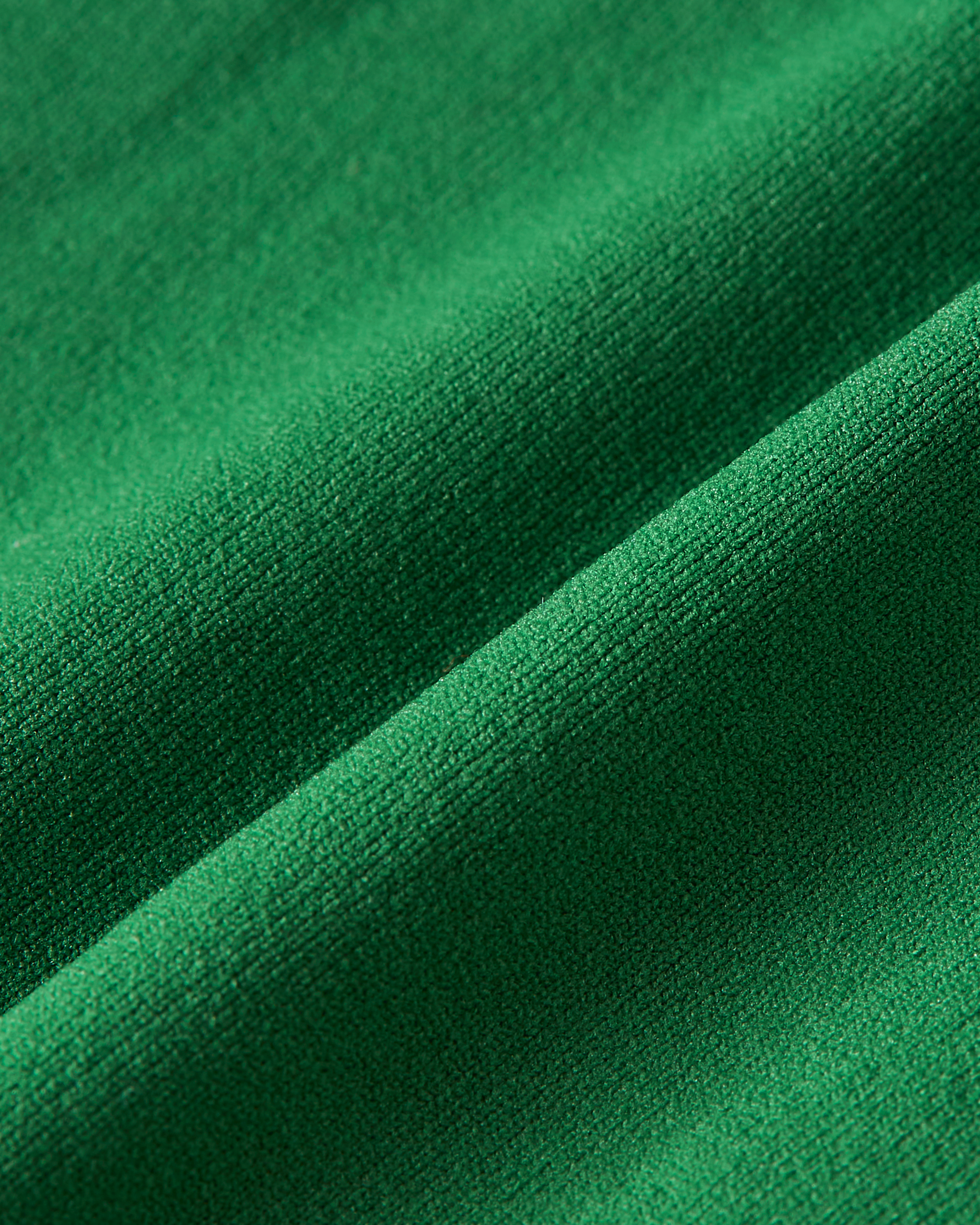 Detailed view of green brazilian fabric with a smooth structure designed to sit comfortably and remain invisible under clothing product image