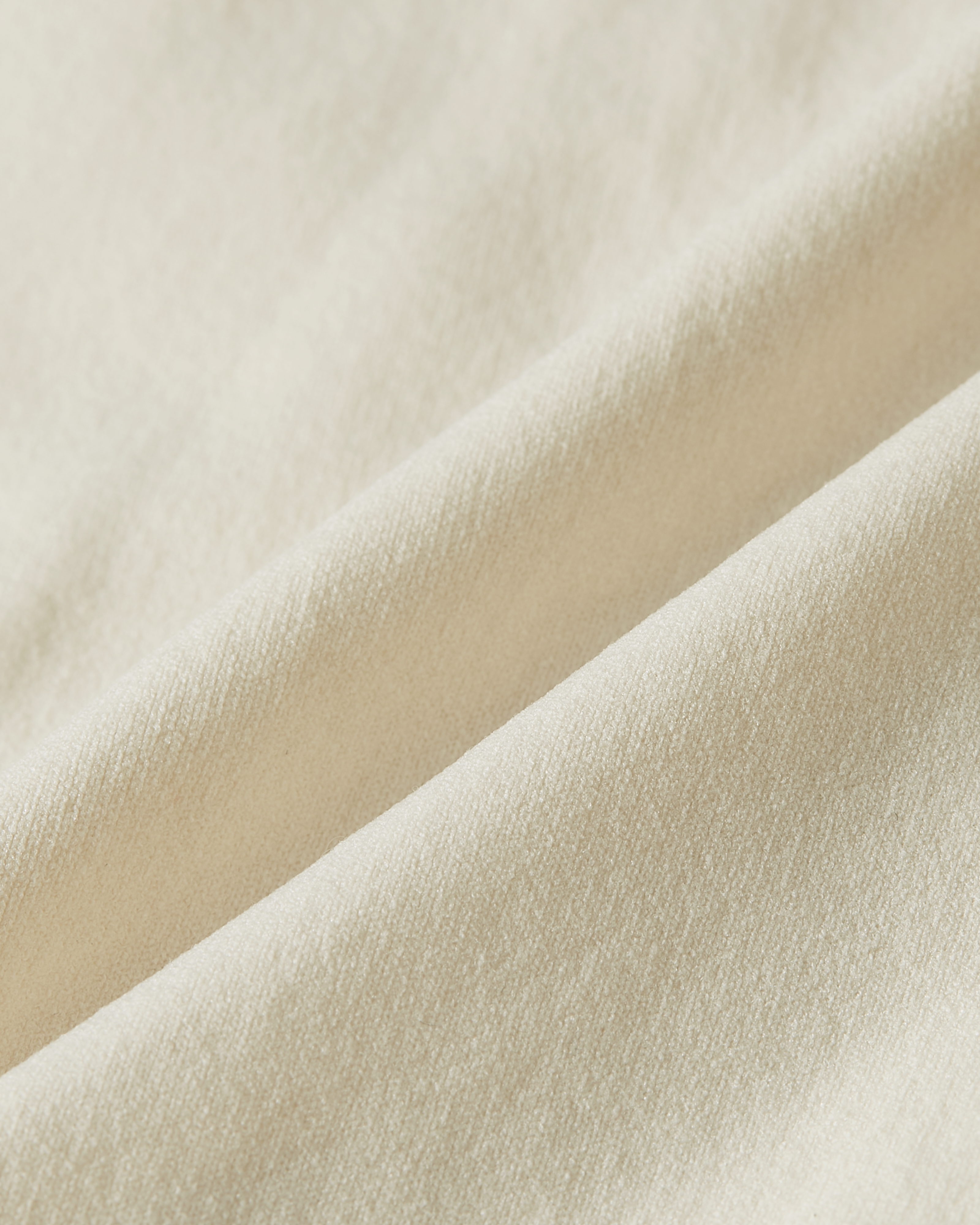 Detail shot of beige Essentials brief fabric, highlighting the natural nude tone, smooth finish and lightweight, flexible feel