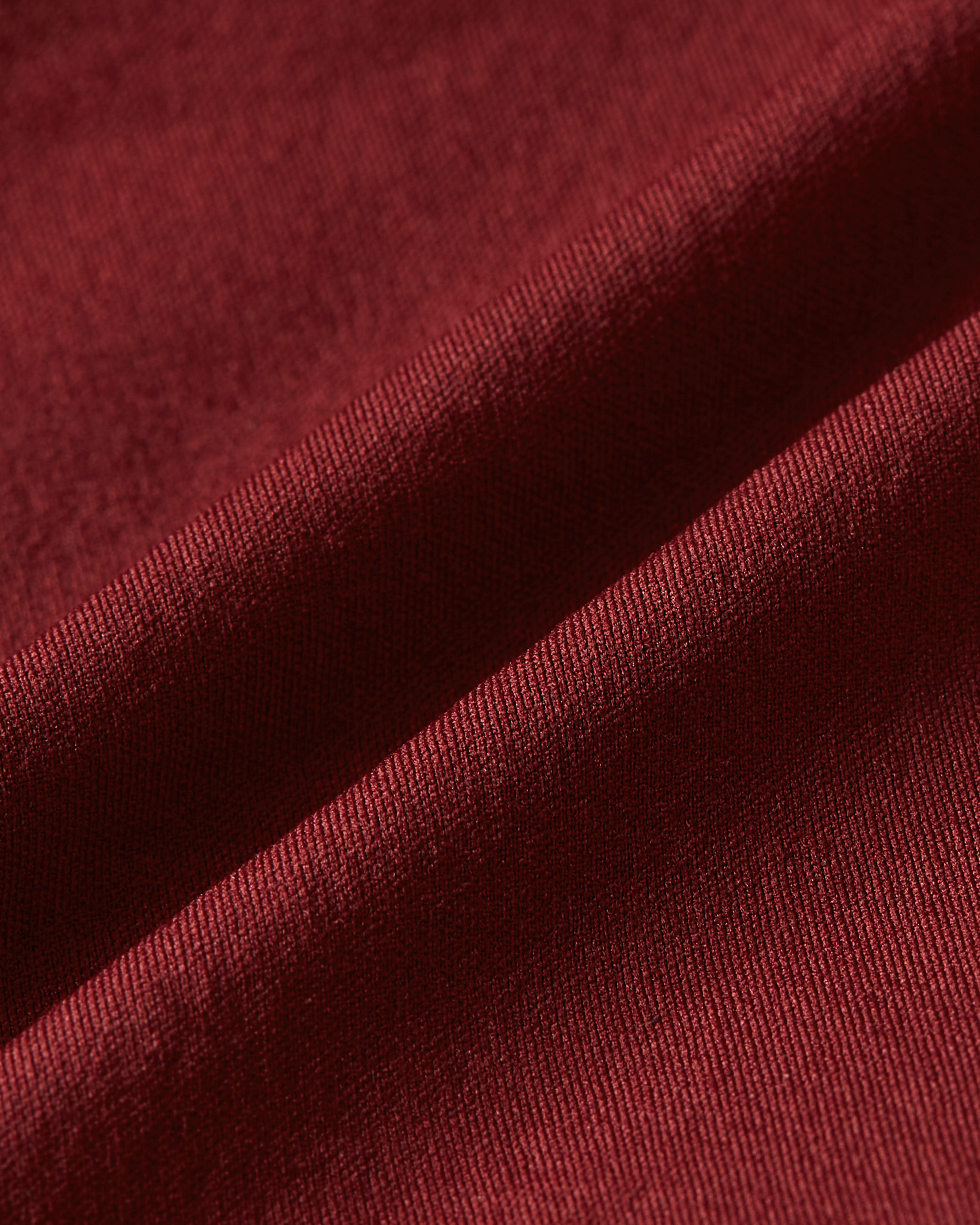 Detail product image of bordeaux shapewear shorts fabric showing a smooth and dense texture with supportive stretch