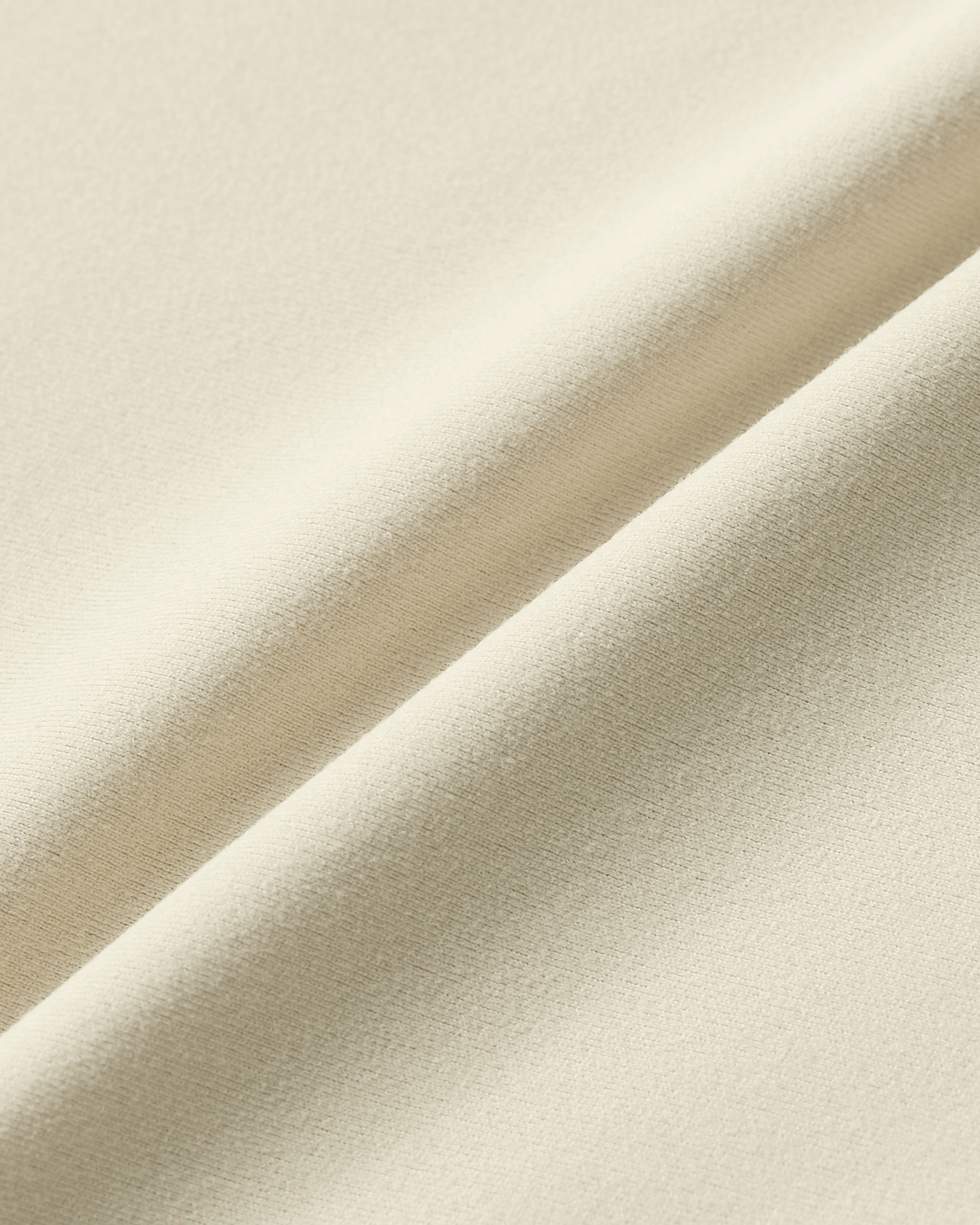 Close-up product photo of beige soft skin t-shirt bodysuit soft skin fabric with soft touch and smooth surface