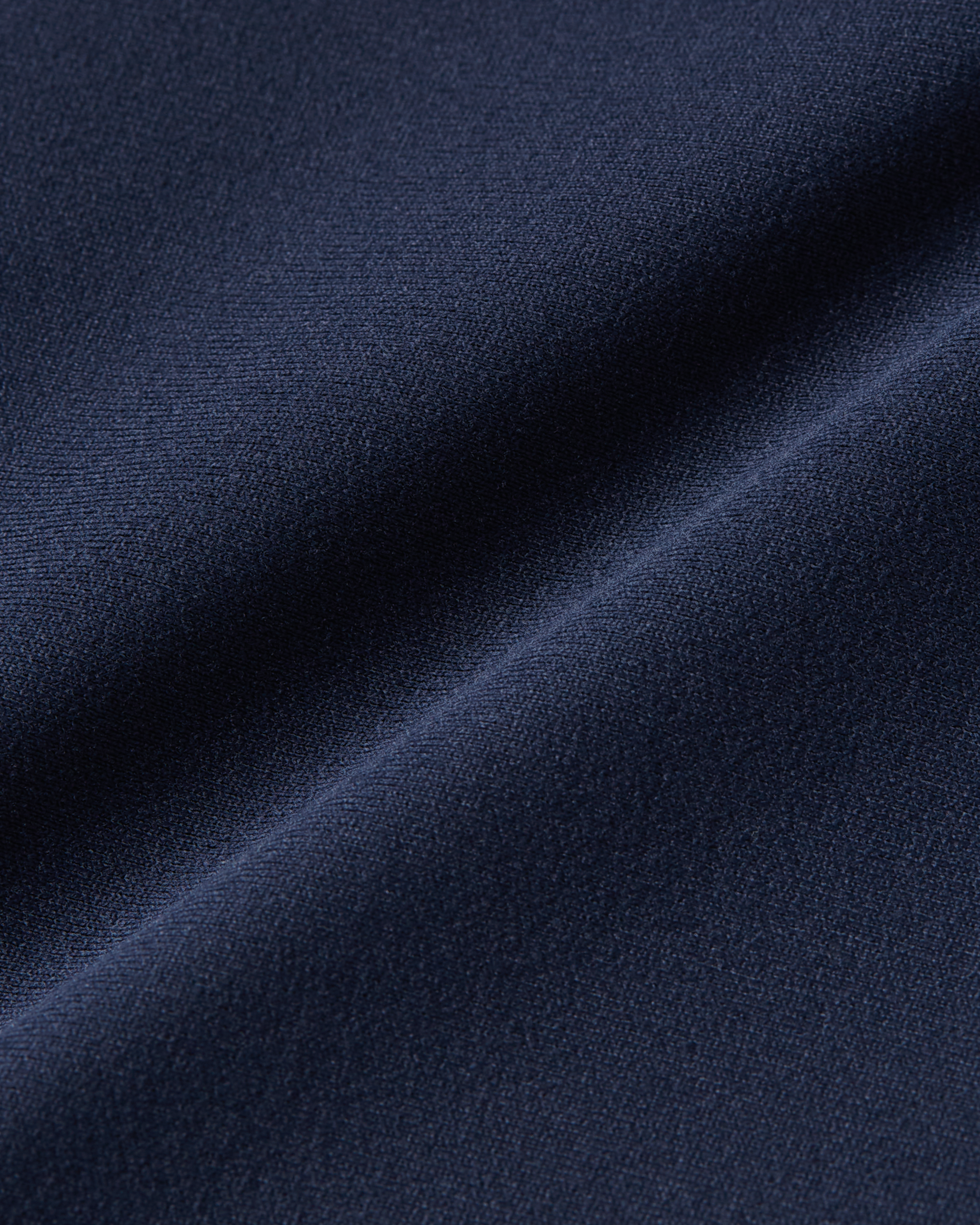 dark blue bodysuit t-shirt close-up fabric showing a dense, smooth texture