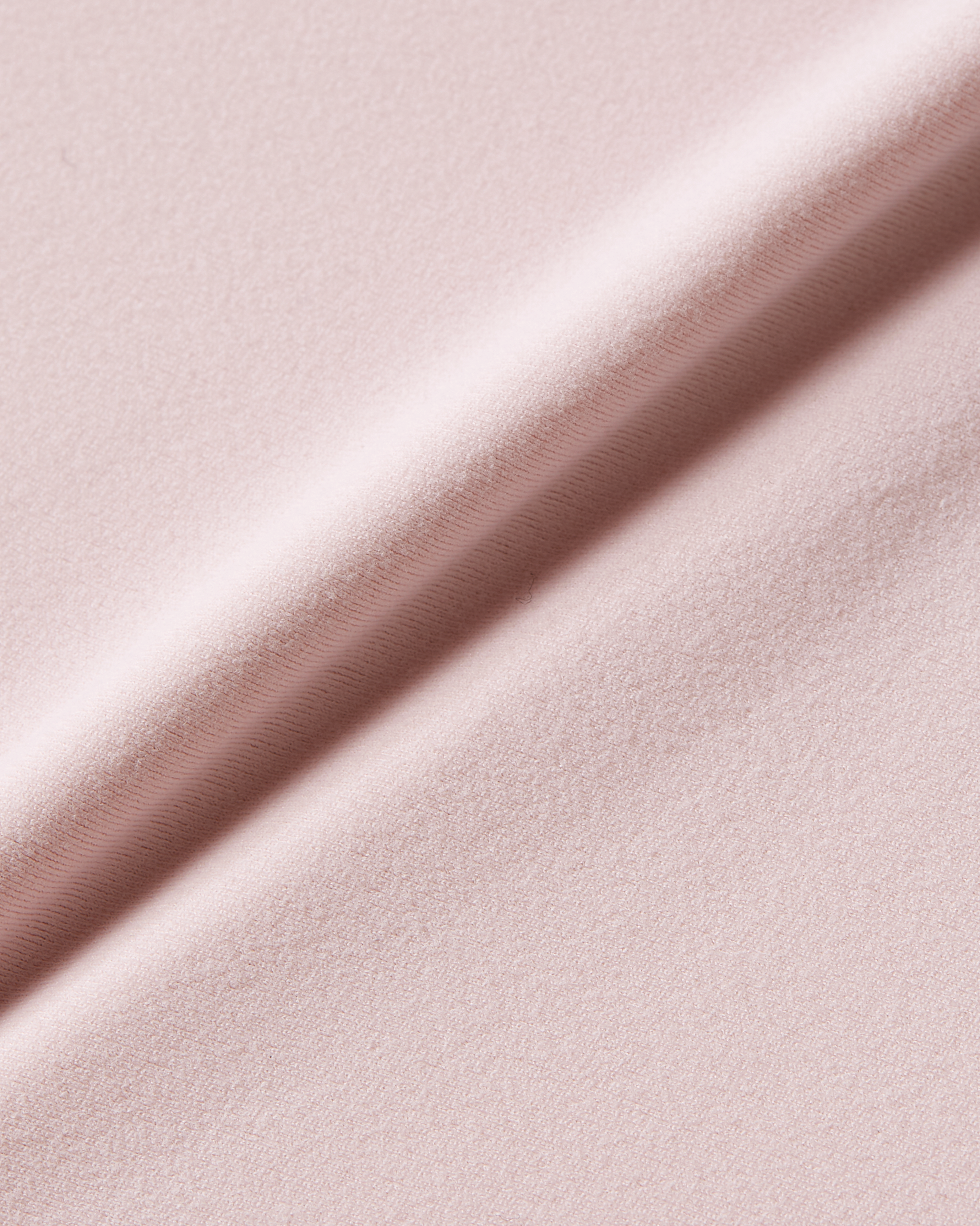 Close-up product photo of pink soft skin t-shirt bodysuit fabric with a soft touch and smooth texture