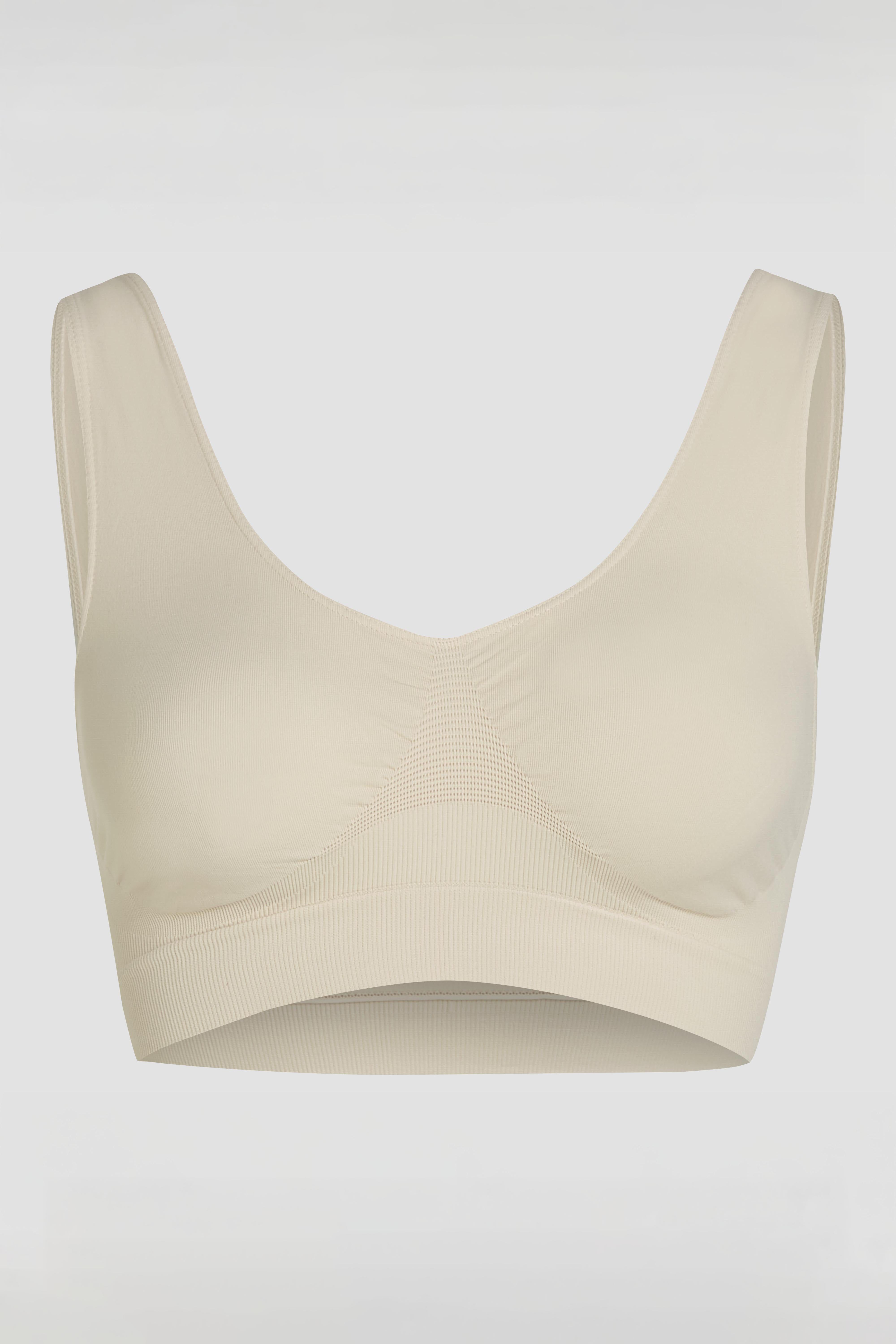 Close-up product photo of beige seamless tank bra with soft stretch fabric