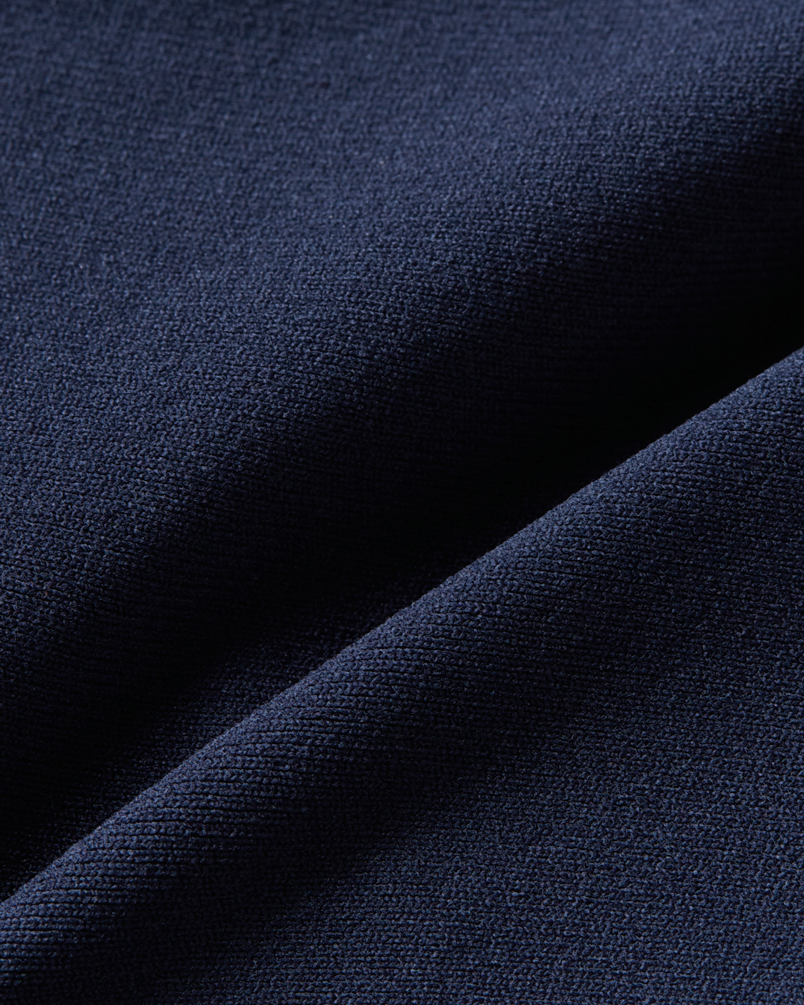 Detail product image of dark blue seamless thong showing a smooth and even fabric