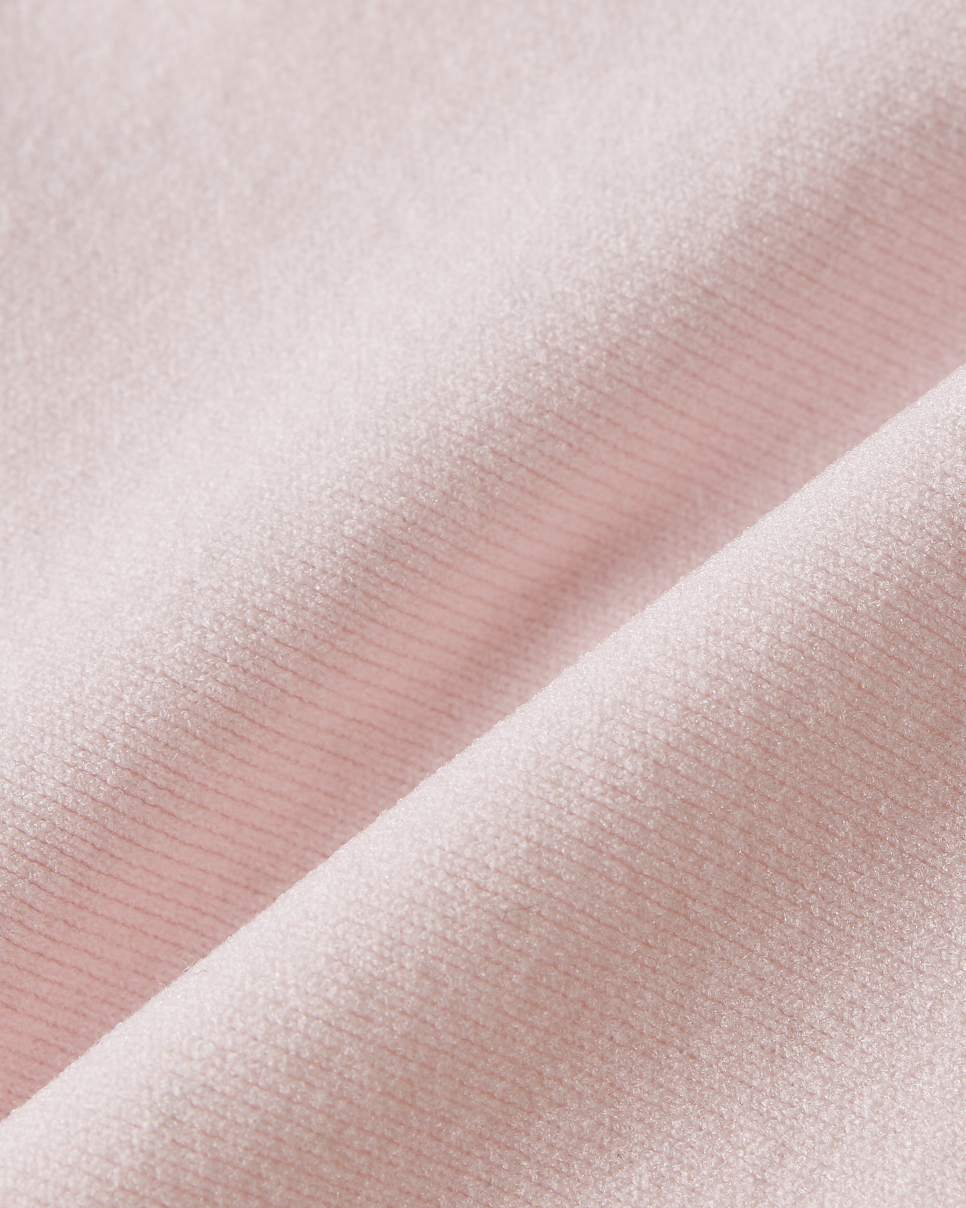 Detail product image of pink seamless thong highlighting a soft and smooth fabric with a light and airy feel