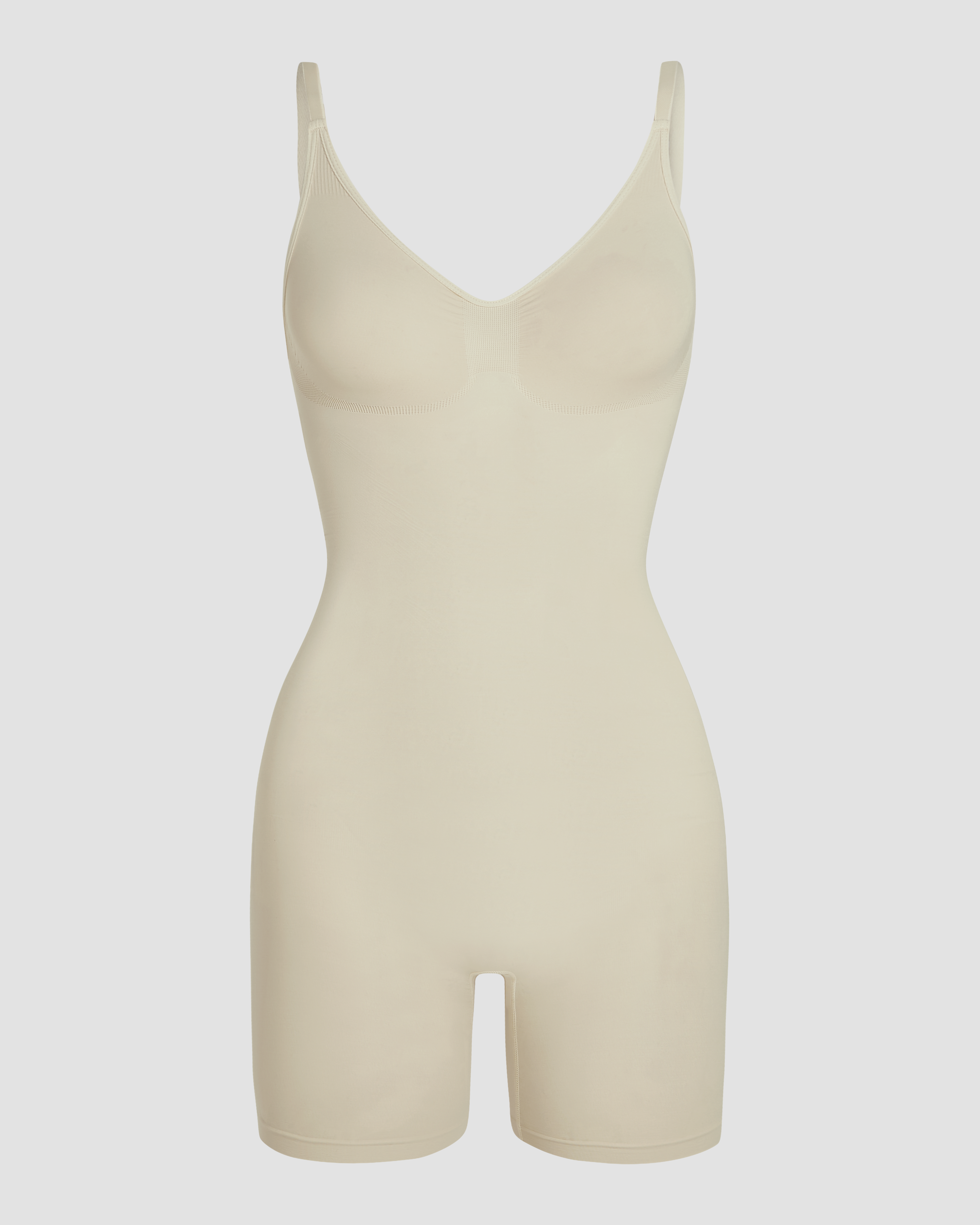 Shapewear bodysuit in beige with shaping fabric and a close fitting silhouette for a clean and natural contoured look product image