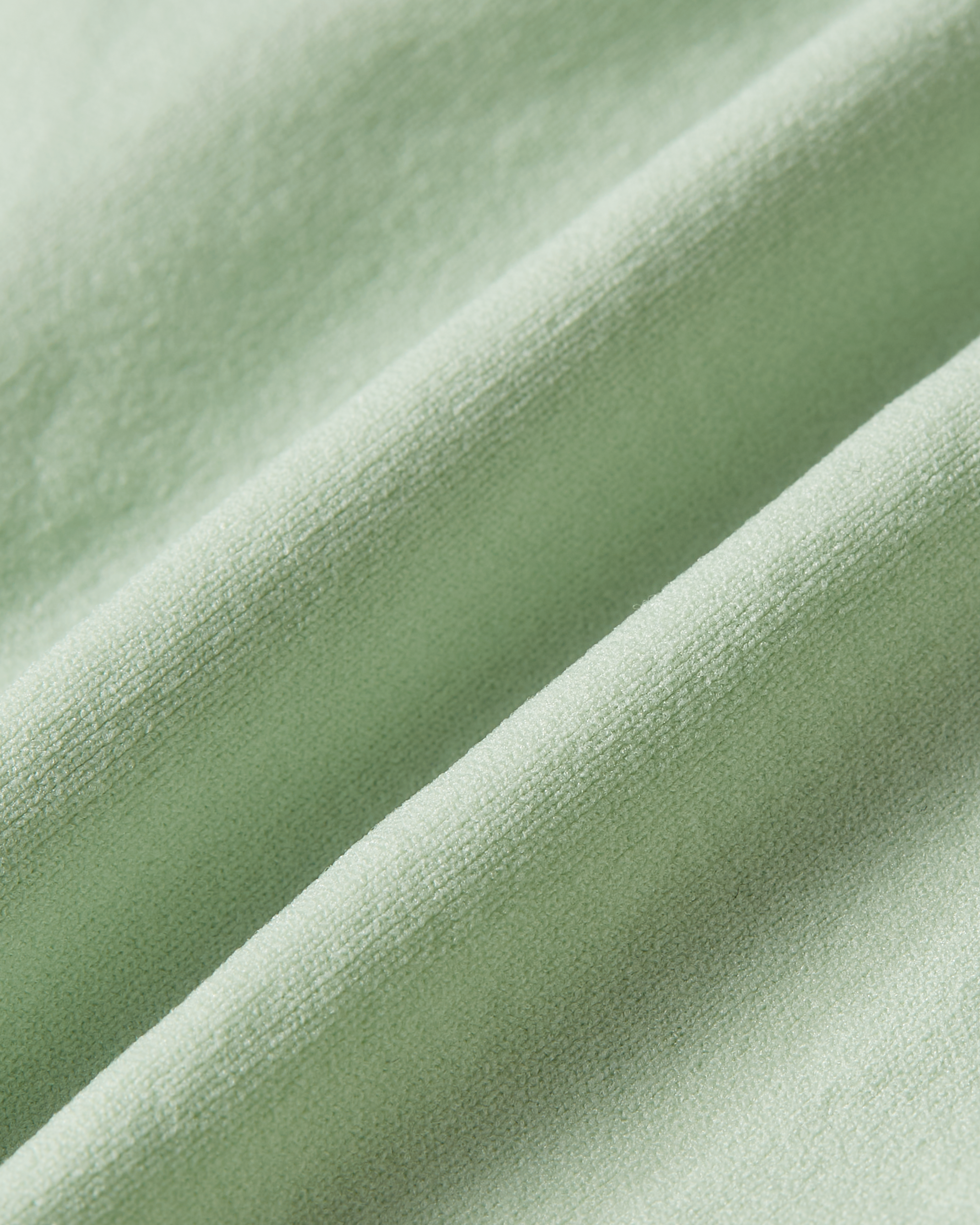 Fabric detail of matcha green Essentials brief, highlighting the fresh green hue, smooth finish and soft, flexible stretch for all-day comfort